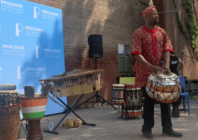 Fana Soro playing a drum at Arts Break at Brick Works