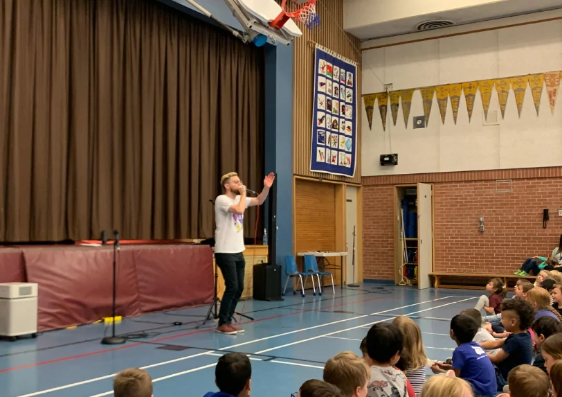 Singer / beatboxer David Lane performs at a school