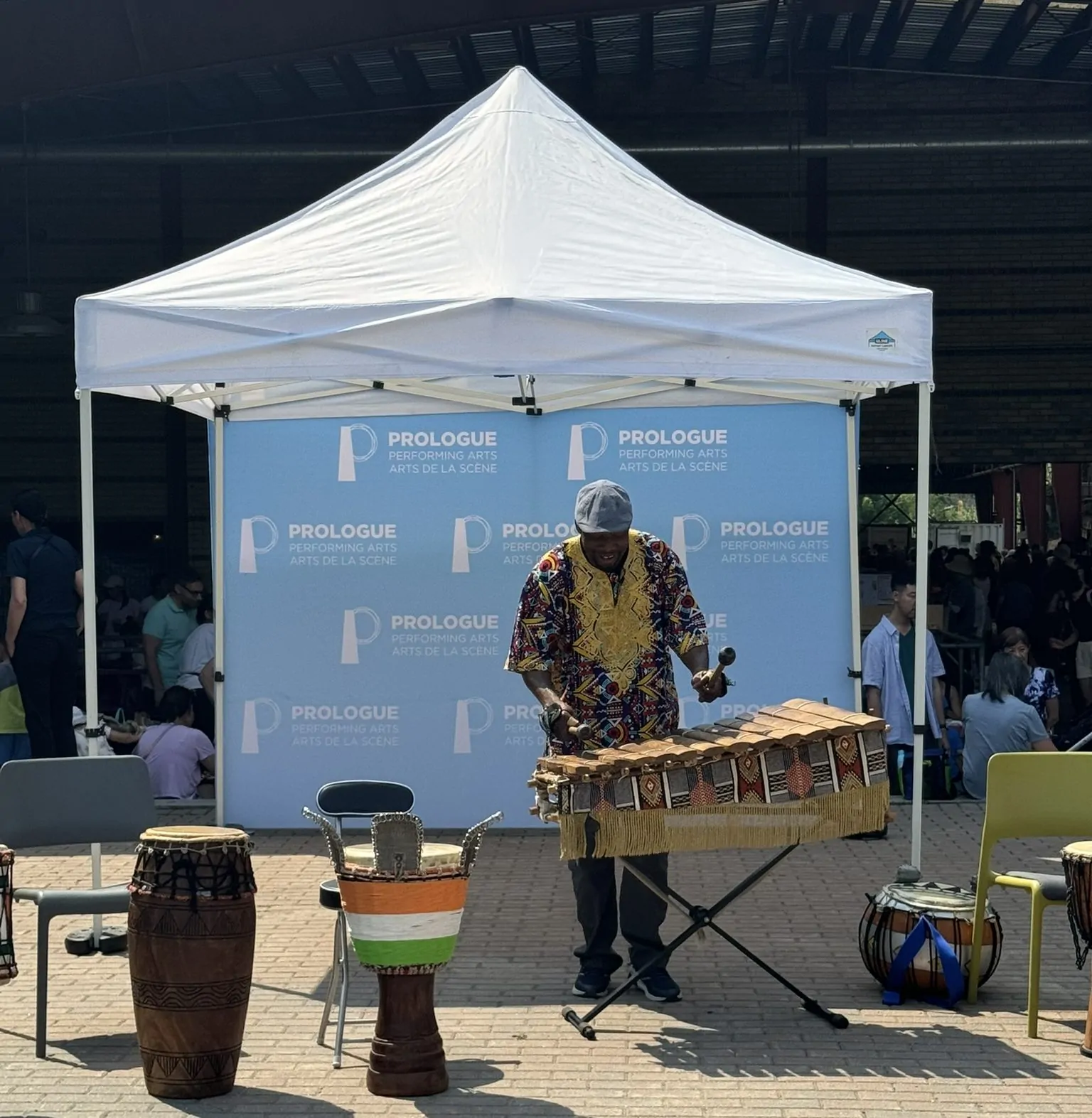 Fana Soro plays the bafalon (like a xylophone) at Summer Arts Break at Brick Works