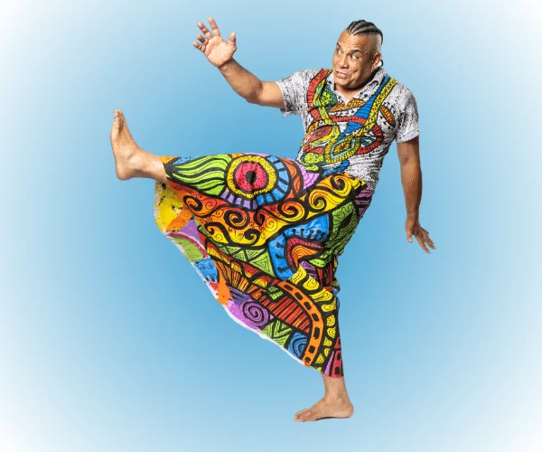 Arts Break 2025 Sergio is traditional wear doing Capoeira move