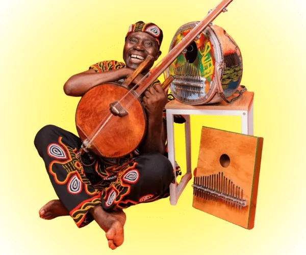 Njacko Back sitting surrounded by instruments 