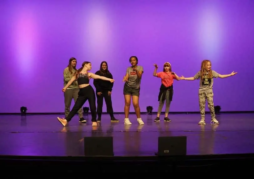Students dancing on stage during the northern residency with School of Toronto Dance Theatre