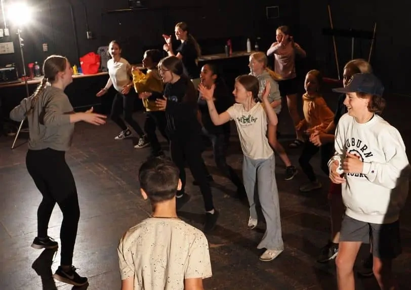 A high school student teaches a junior class during the northern residency with School of Toronto Dance Theatre
