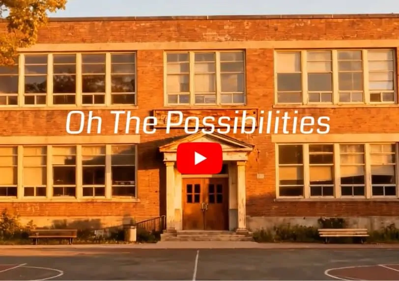 Oh The Possibilities Oh The Possibilities - photo outside of a school. Play button for YouTube video